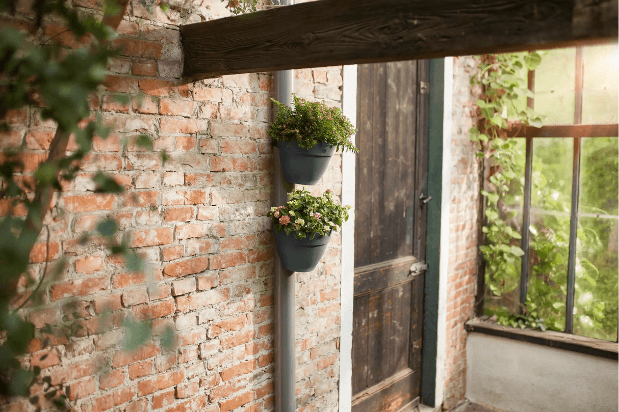 Vibia campana flowerpot for drainpipes
