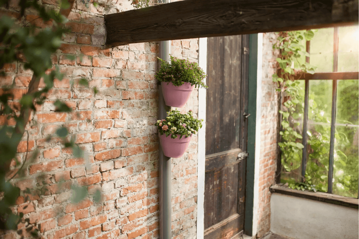 Vibia campana flowerpot for drainpipes