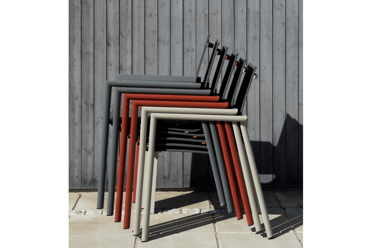 Delia stackable chair with armrest